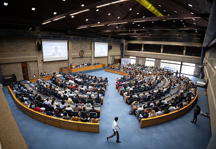 Youth delegates gathered in a large UNEP conference room